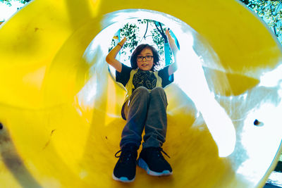 Child sliding in playground