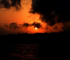 Scenic view of sea against orange sky