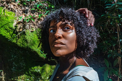 Portrait of woman against plants