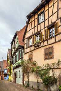 Street with historical half-timbered houses in kaysersberg, alsace, france