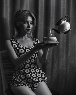 Young woman with coffee cup