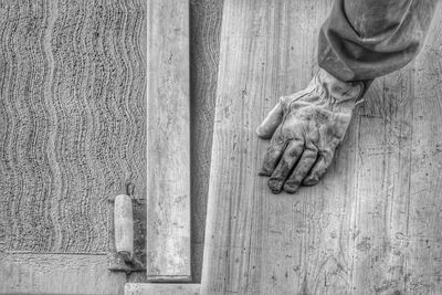 Cropped image of gloved hand at construction site