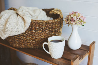 Close-up of cup and coffee on table