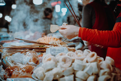 Midsection of woman preparing food