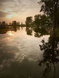 Scenic view of lake against sky during sunset