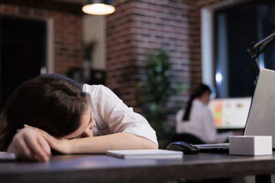 Close-up of girl studying at table