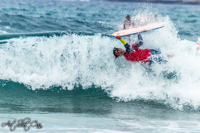 Man splashing water in sea