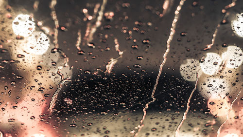 Full frame shot of wet glass window in rainy season