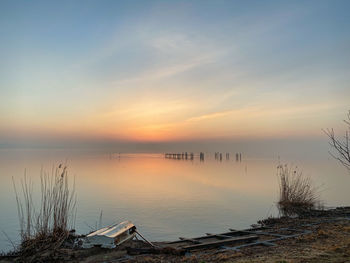 Scenic view of lake against sky during sunset