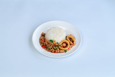 Directly above shot of food in bowl on white background