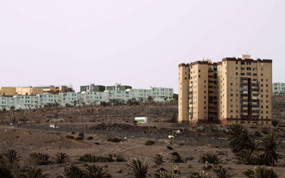 Buildings against clear sky