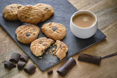 High angle view of cookies and coffee on table