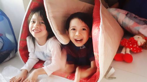 High angle view of cute baby girl sitting