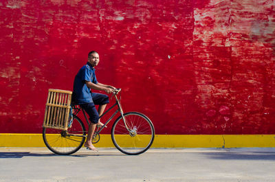 Man riding bicycle in china town