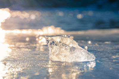 Close-up of ice on water