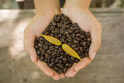 Midsection of person holding coffee cup