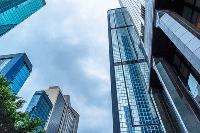 Low angle view of modern buildings against sky in city