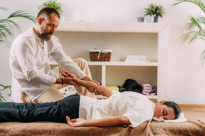 Shiatsu hand massage. therapist massaging the heart meridian.