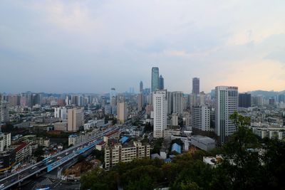 High angle view of buildings in city against sky