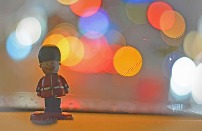 Boy with toy on table