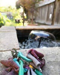 Close-up of hand holding bicycle