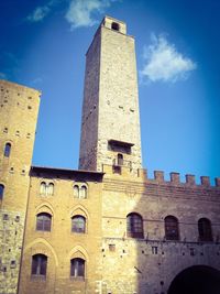 Low angle view of built structure against blue sky