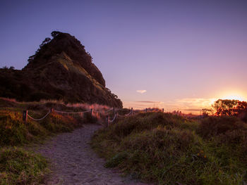 Narrow pathway along calm sea