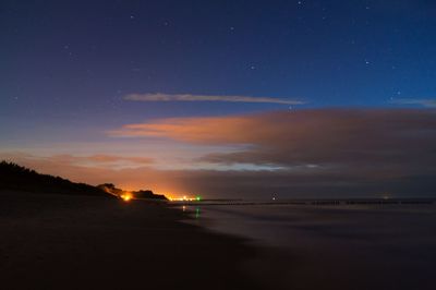 Scenic view of sea against sky at night