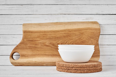 High angle view of bread and cutting board on table