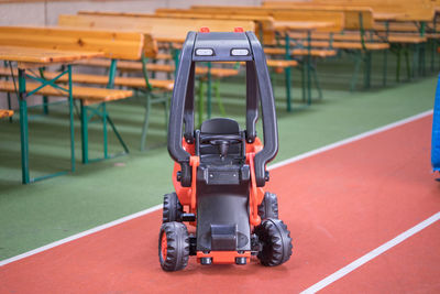 Toy car on floor in classroom