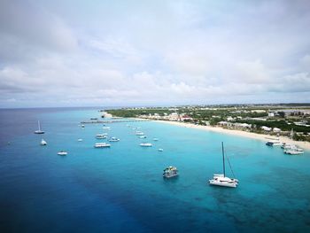 High angle view of boats in sea against sky