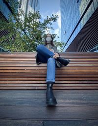 Low section of woman sitting on staircase