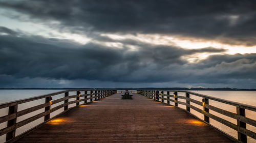 Pier over sea against sky