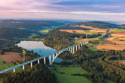 Scenic view of bridge over river against sky
