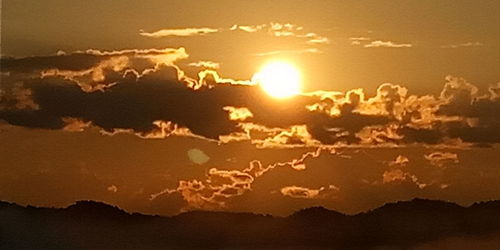Scenic view of silhouette land against sky during sunset