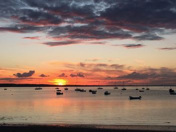 Scenic view of sea against orange sky