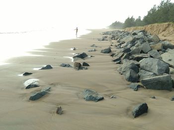Scenic view of beach against clear sky