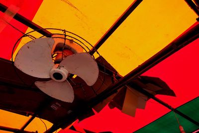 Low angle view of ferris wheel at sunset