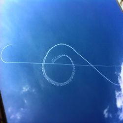 Close-up of airplane against blue sky