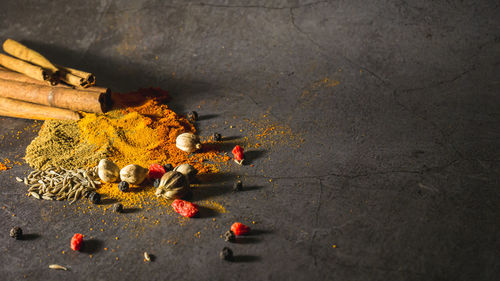 High angle view of orange flowers on wood