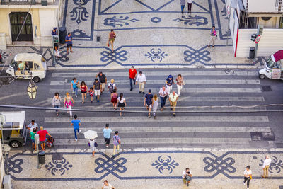 High angle view of people crossing road