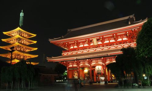 Low angle view of illuminated temple against sky at night