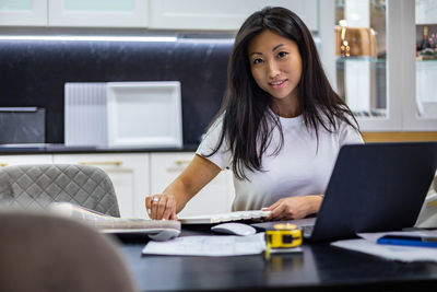 Businesswoman sitting at desk in office