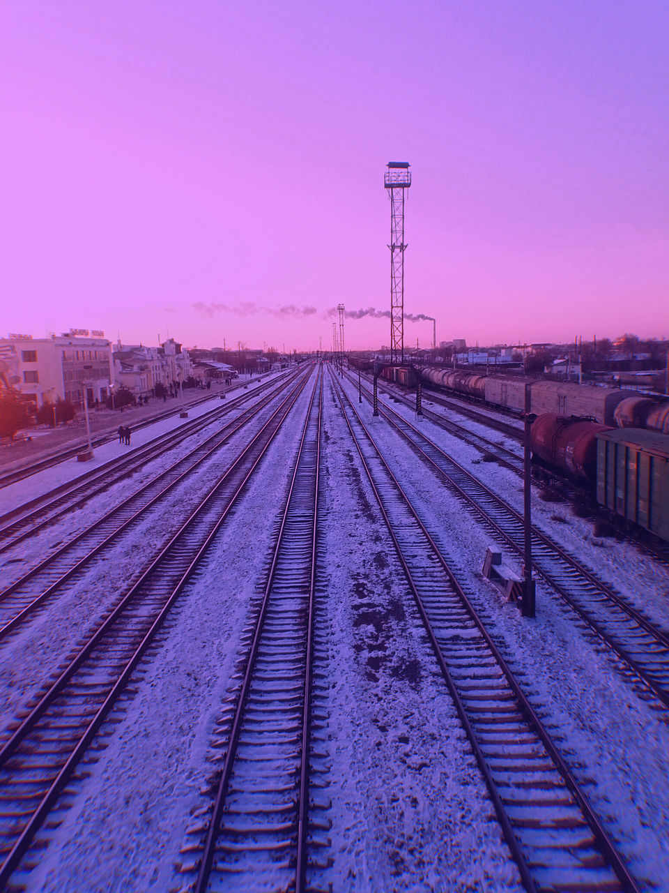 railroad track, rail transportation, track, sky, transportation, nature, transport, horizon, no people, architecture, line, train, railway, technology, sunset, diminishing perspective, mode of transportation, vanishing point, built structure, outdoors, city, snow, clear sky, electricity, dusk, the way forward, public transportation, evening, winter, environment, landscape, travel, cold temperature