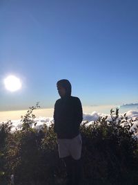 Man standing against clear sky during sunset