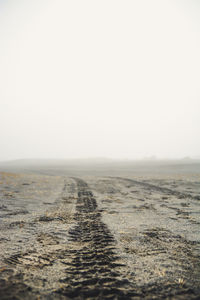 Surface level of land against clear sky
