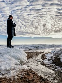 Full length of man standing on rock
