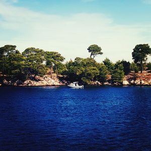 Scenic view of calm sea against cloudy sky