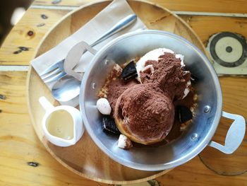 High angle view of dessert in bowl on plate over table