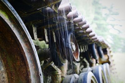 Close-up of old rusty wheel in row